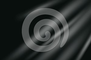 Soft white light rays on black background